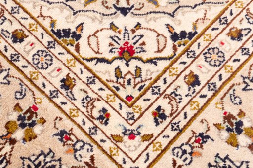 Close-up detail of 1988s Kashan rug from Iran / Persia showing Wool weave