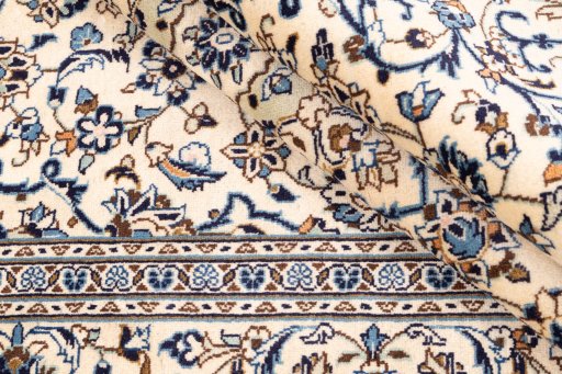 Surface texture of 2000s Kashan rug with natural Wool and intricate pattern