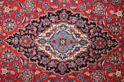 Corner detail of 2000s Kashan rug showing border pattern and Wool pile