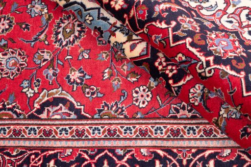 Corner detail of 1977s Kashan rug showing border pattern and Wool pile