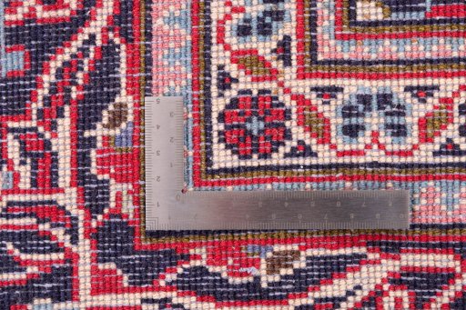 Close-up detail of 1977s Kashan rug from Iran / Persia showing Wool weave