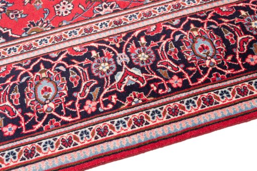Backside of handmade 1977s Kashan rug showing knot structure and weave density
