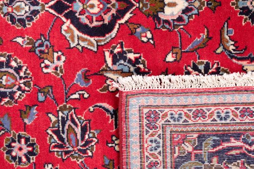 Close-up detail of 1977s Kashan rug from Iran / Persia showing Wool weave