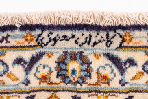 Corner detail of 1970s Kashan rug showing border pattern and Wool pile