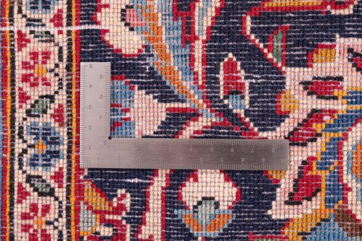 Close-up detail of 1980s Kashan rug from Iran / Persia showing Wool weave
