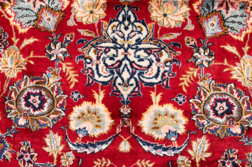 Close-up detail of 1980s Kashan rug from Iran / Persia showing Wool weave
