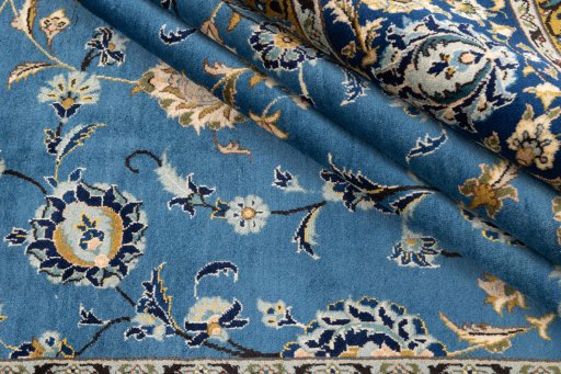 Close-up detail of 1973s Kashan rug from Iran / Persia showing Wool weave