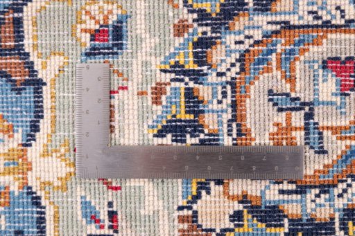 Backside of handmade 1975s Kashan rug showing knot structure and weave density