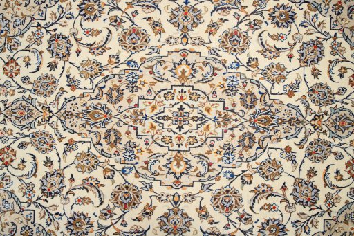 Corner detail of 2000s Kashan rug showing border pattern and Wool pile