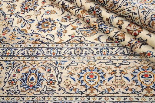 Close-up detail of 2000s Kashan rug from Iran / Persia showing Wool weave