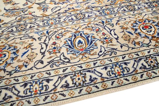 Backside of handmade 2000s Kashan rug showing knot structure and weave density