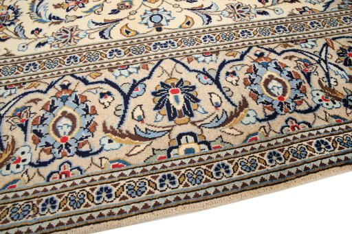 Backside of handmade 2000s Kashan rug showing knot structure and weave density