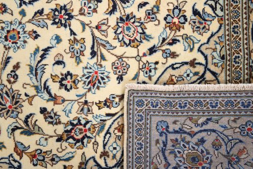 Close-up detail of 2000s Kashan rug from Iran / Persia showing Wool weave
