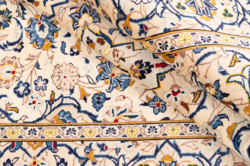 Corner detail of 1983s Kashan rug showing border pattern and Wool pile