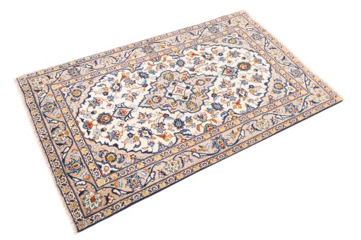 Corner detail of 2000s Kashan rug showing border pattern and Wool pile