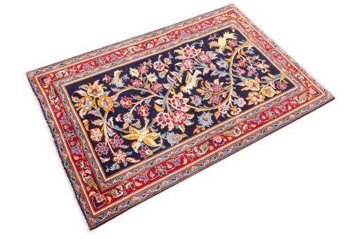 Corner detail of 1980s Kashan rug showing border pattern and Wool pile