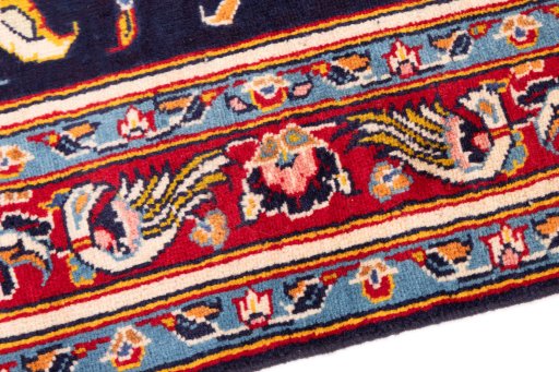 Backside of handmade 1980s Kashan rug showing knot structure and weave density