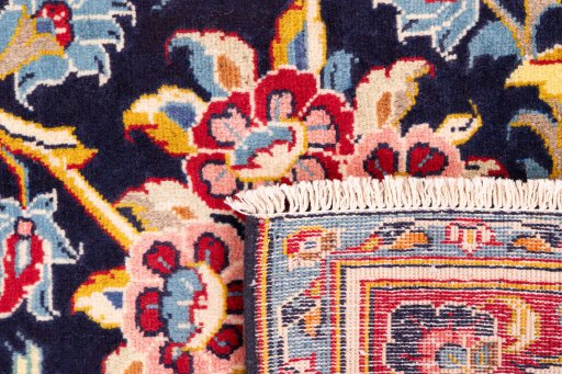 Close-up detail of 1980s Kashan rug from Iran / Persia showing Wool weave
