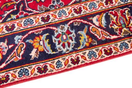 Backside of handmade 2000s Kashan rug showing knot structure and weave density