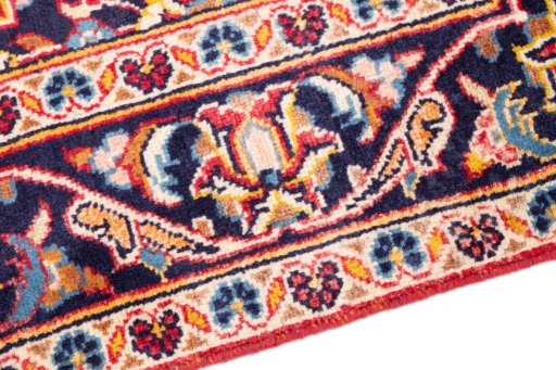 Backside of handmade 2000s Kashan rug showing knot structure and weave density