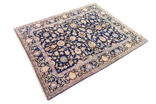 Corner detail of 2003s Kashan rug showing border pattern and Wool pile