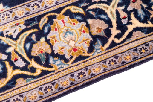 Backside of handmade 2003s Kashan rug showing knot structure and weave density