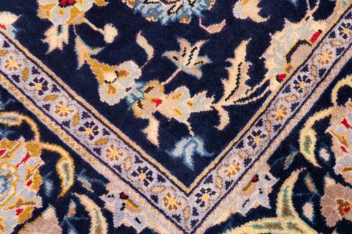 Close-up detail of 2003s Kashan rug from Iran / Persia showing Wool weave