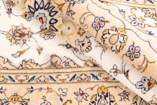 Corner detail of 2003s Kashan rug showing border pattern and Wool pile