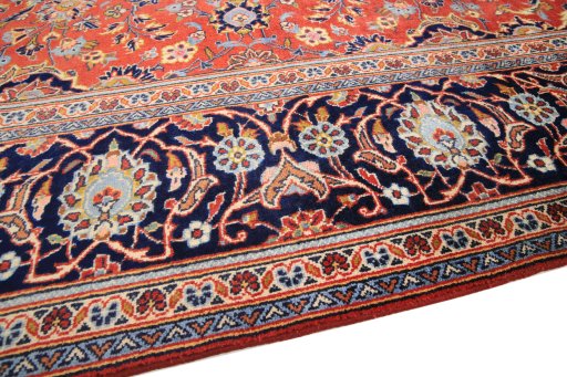 Backside of handmade 1990s Kashan rug showing knot structure and weave density