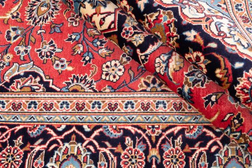 Close-up detail of 1975s Kashan rug from Iran / Persia showing Wool weave