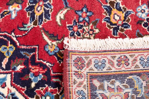 Close-up detail of 1998s Kashan rug from Iran / Persia showing Wool weave
