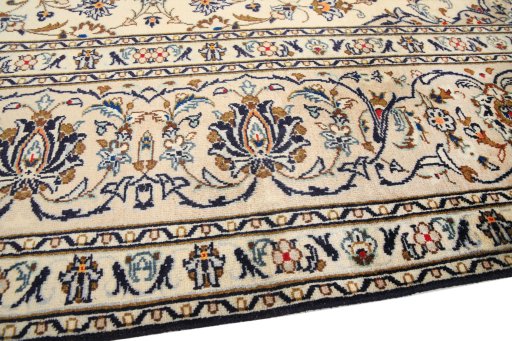 Backside of handmade 1990s Kashan rug showing knot structure and weave density