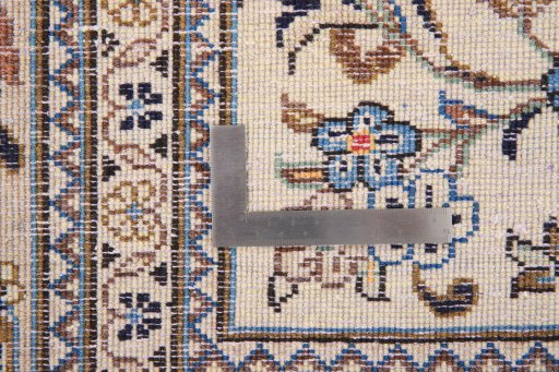 Surface texture of 2000s Kashan rug with natural Wool and intricate pattern