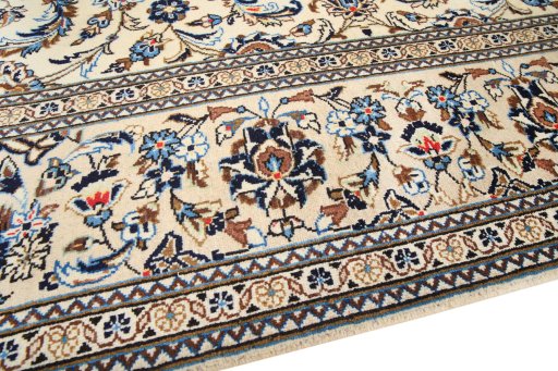 Backside of handmade 2000s Kashan rug showing knot structure and weave density