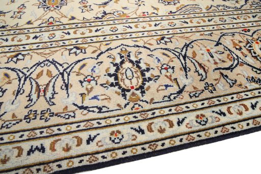 Backside of handmade 2000s Kashan rug showing knot structure and weave density