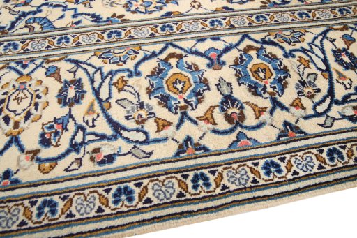 Backside of handmade 2000s Kashan rug showing knot structure and weave density