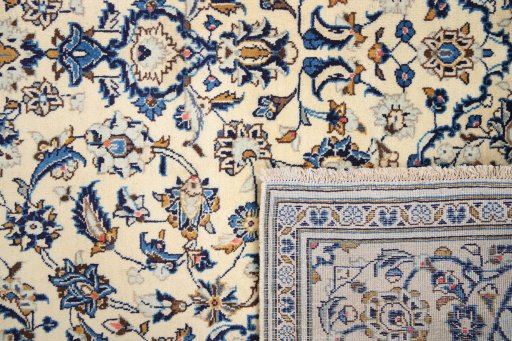 Close-up detail of 2000s Kashan rug from Iran / Persia showing Wool weave