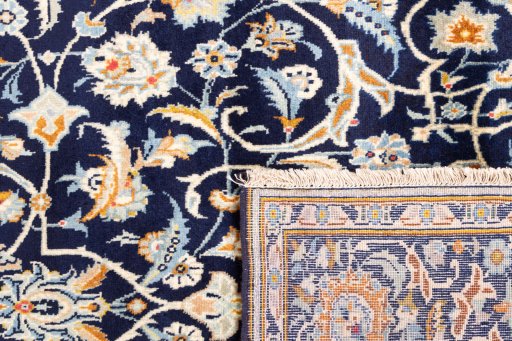 Close-up detail of 1979s Kashan rug from Iran / Persia showing Wool weave