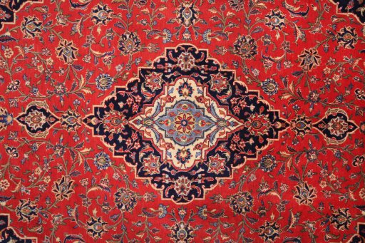 Corner detail of 2000s Kashan rug showing border pattern and Wool pile