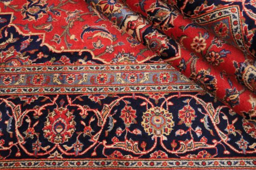 Close-up detail of 2000s Kashan rug from Iran / Persia showing Wool weave