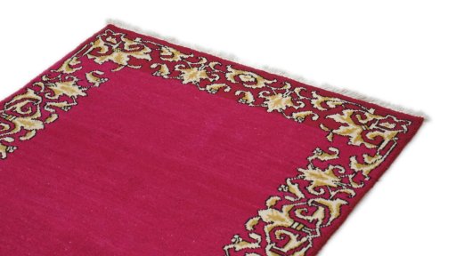 Backside of handmade 1990s Kashan rug showing knot structure and weave density