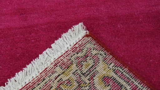 Close-up detail of 1990s Kashan rug from Iran / Persia showing Wool weave