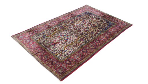 Corner detail of 1920s Kashan rug showing border pattern and Silk pile