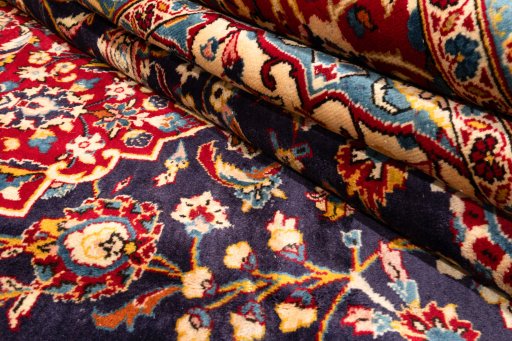 Corner detail of 1990s Kashan rug showing border pattern and Wool pile