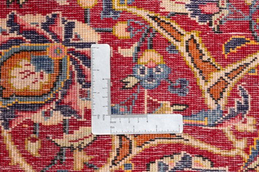 Backside of handmade 1990s Kashan rug showing knot structure and weave density