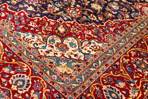 Backside of handmade 1990s Kashan rug showing knot structure and weave density
