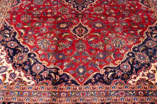 Corner detail of 1990s Kashan rug showing border pattern and Wool pile