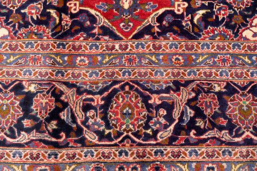 Close-up detail of 1990s Kashan rug from Iran / Persia showing Wool weave