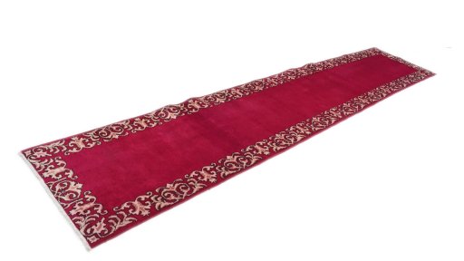 Corner detail of 2000s Kashan rug showing border pattern and Wool pile