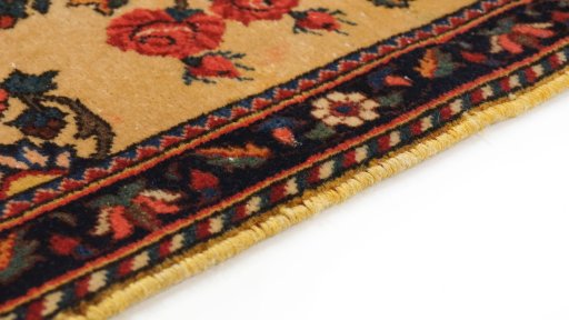 Backside of handmade 1960s Kashan rug showing knot structure and weave density